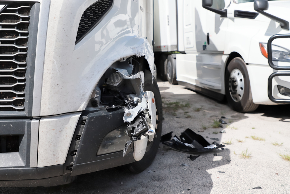 Close-up of damage to semi-truck after accident
